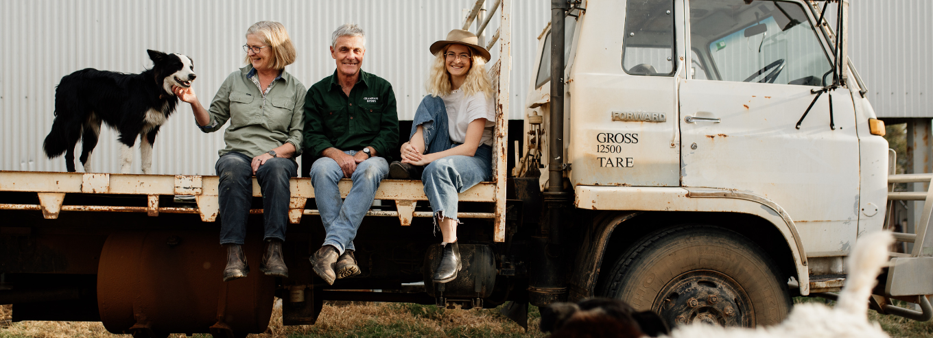 Grampians Estate owners with their dog on a truck 